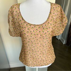 Sheer shirt with yellow accent zipper down the back. Shorter in the front.